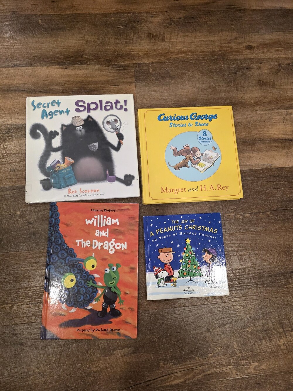 Set of 4 Children's Books. Splat, Curious George, Peanuts, William & The Dragon